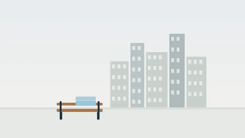 איור: קו רקיע עירוני וספסל עם שמיכה מקופלת